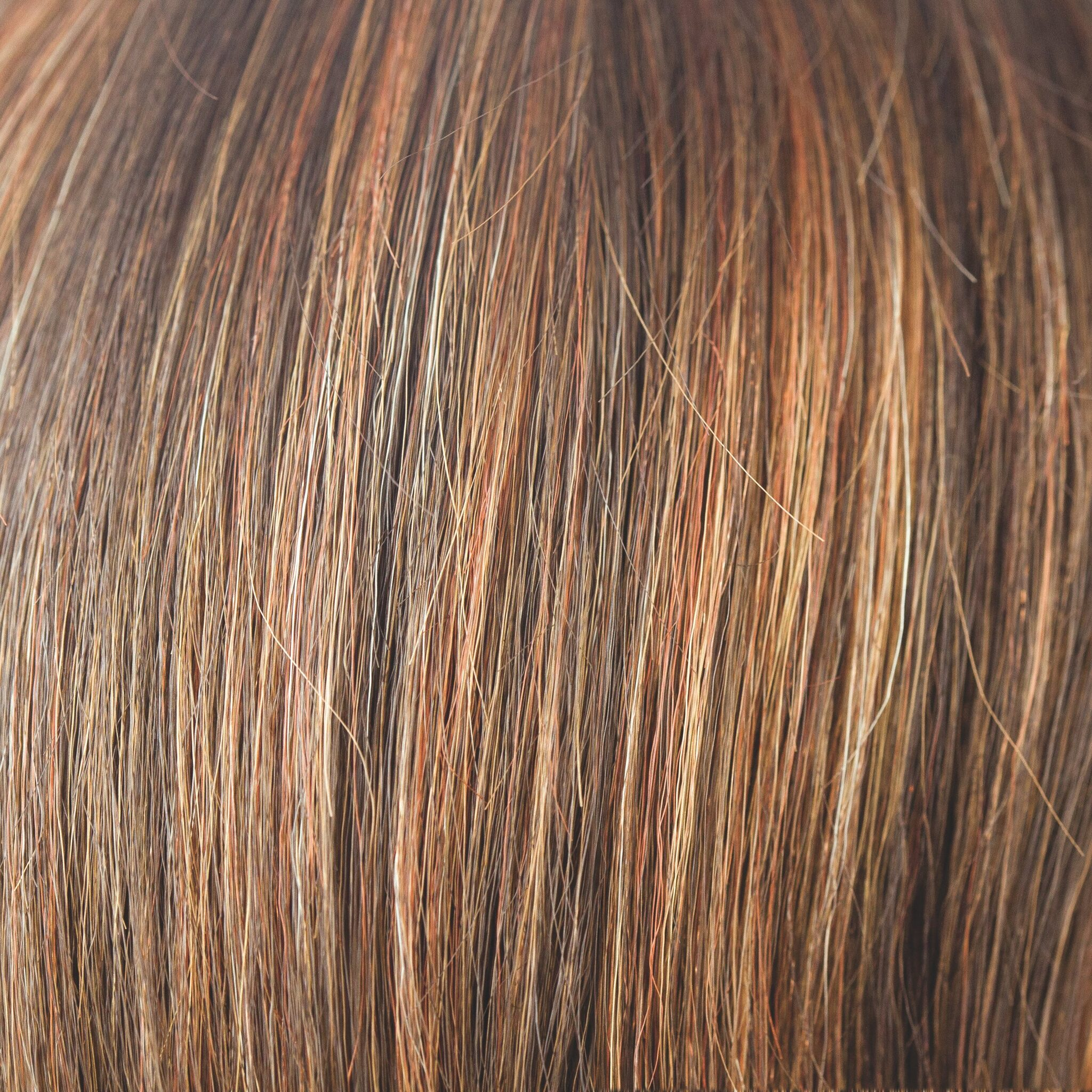 Dark Rust  -  A medium to light multi-tonal red with highlights and lowlights of rusty red shades and apricot bronze with tastefully placed slices of Tuscan terracotta.