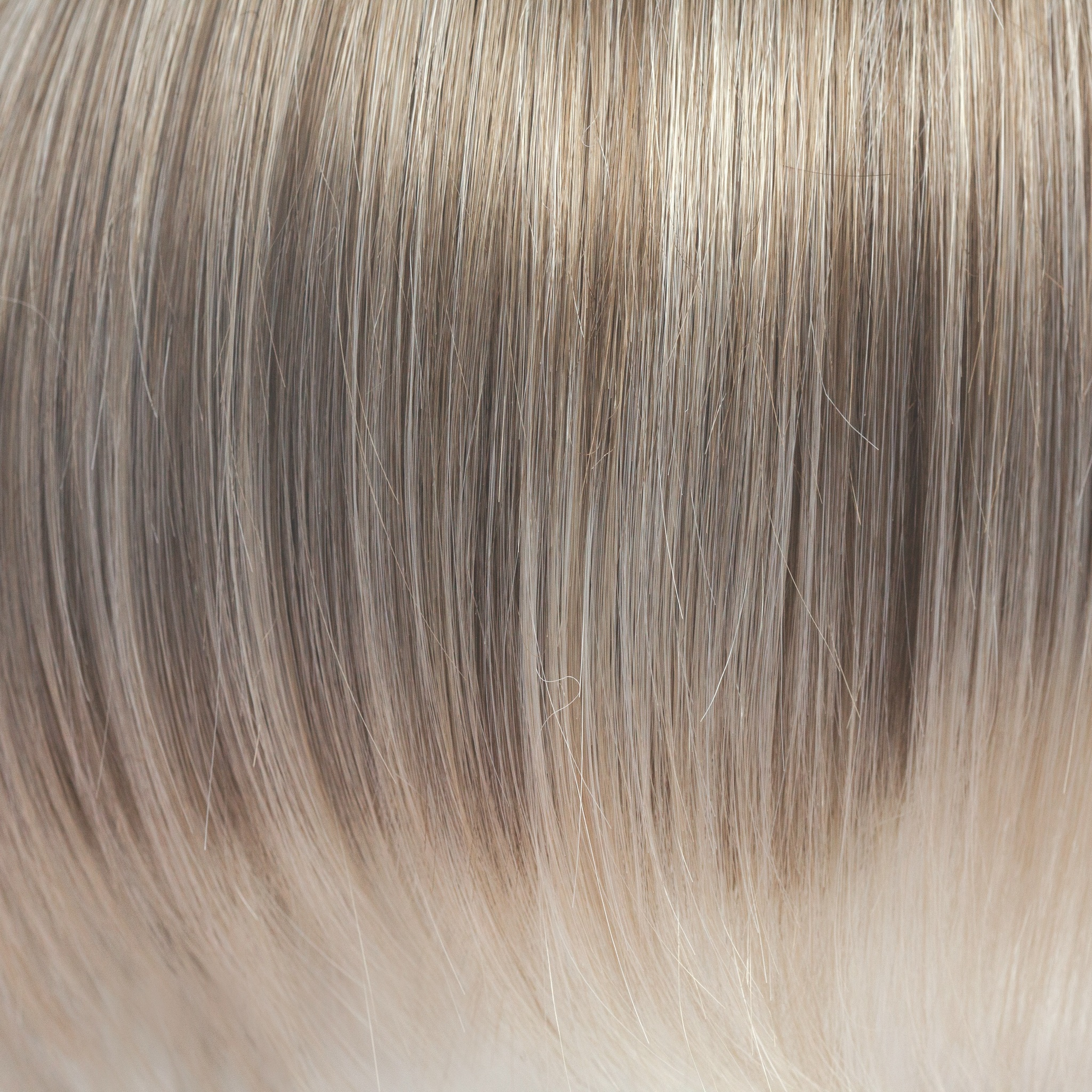 Ice Blond  -  This captivating clever color has a blend of beautiful ash blond highlights and velvet blonds. Towards the ends of the hair you are hit with blocks of ice blonde tips. This Ice Blond color combination is great in any style. It is crisp and cool… we love it!